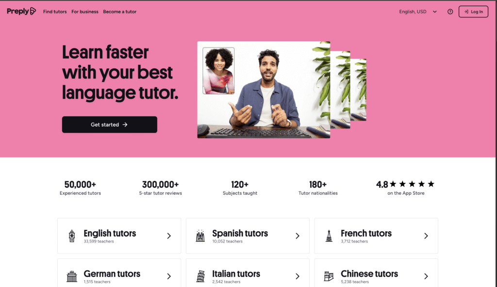 A cheerful male tutor giving an online language lesson via video call, gesturing expressively while sitting at a desk with a keyboard, accompanied by a smiling female student on the screen. The background features vibrant pink color with layered image effect and green houseplants, promoting the message “Learn faster with your best language tutor